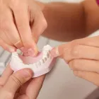 Yrityksen 1 kuva HAMMASLABORATORIO AKI PÄRNÄNEN Hammasproteesien, keinohampaiden ym. valmistus  Kuopio 15